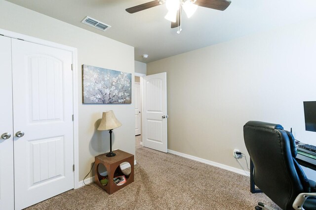 8812 16th St, Lubbock, TX 79416 - home office with visible vents, a ceiling fan, baseboards, and light carpet