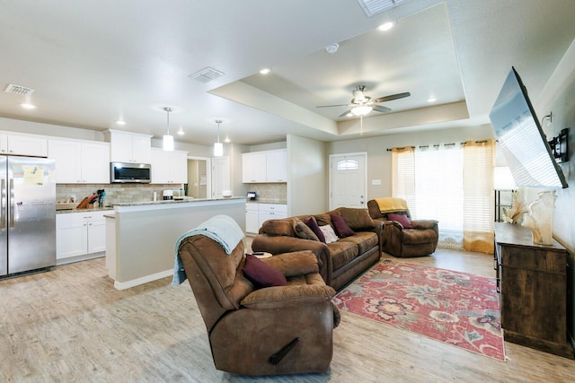 8812 16th St, Lubbock, TX 79416 - living room featuring a ceiling fan, visible vents, recessed lighting, and light wood-type flooring