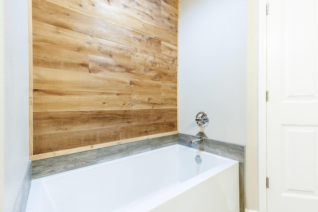 8812 16th St, Lubbock, TX 79416 - full bath with a bathing tub and wooden walls