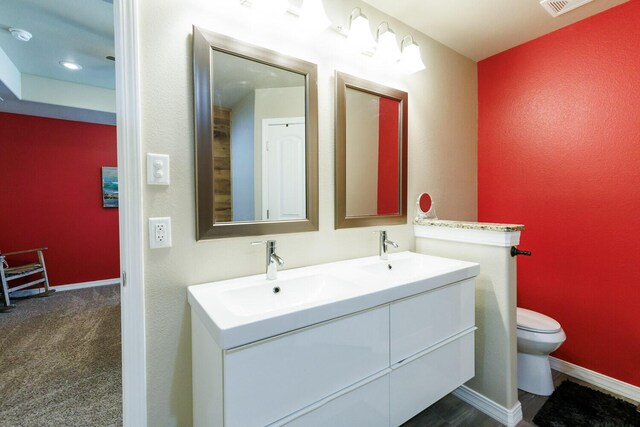 8812 16th St, Lubbock, TX 79416 - full bath featuring a sink, baseboards, toilet, and double vanity