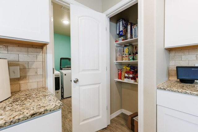 8812 16th St, Lubbock, TX 79416 - storage area featuring visible vents and washing machine and dryer