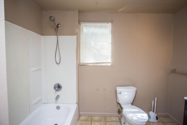 bathroom featuring shower / washtub combination and toilet