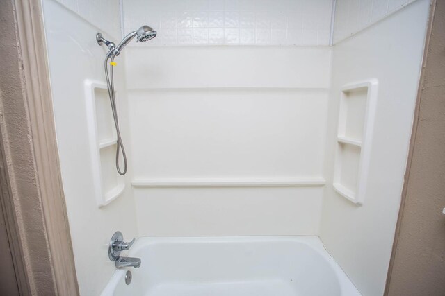 bathroom featuring washtub / shower combination