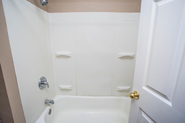 bathroom featuring  shower combination