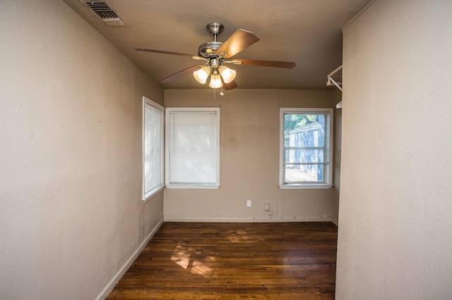 unfurnished room featuring ceiling fan and dark hardwood / wood-style floors