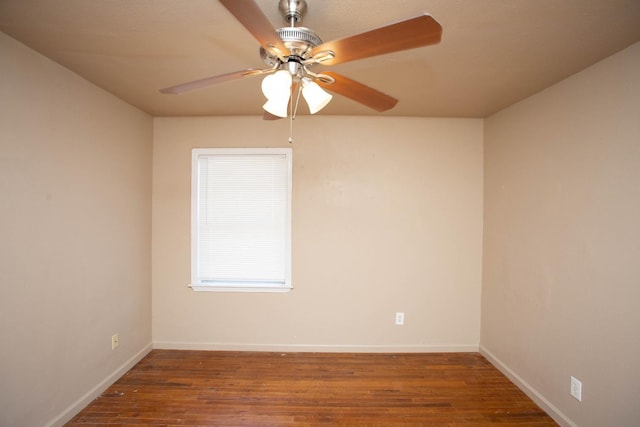 spare room featuring dark hardwood / wood-style floors and ceiling fan