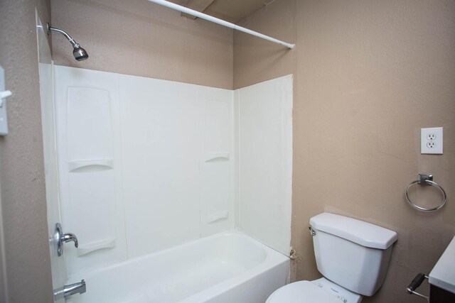 bathroom with shower / bath combination and toilet