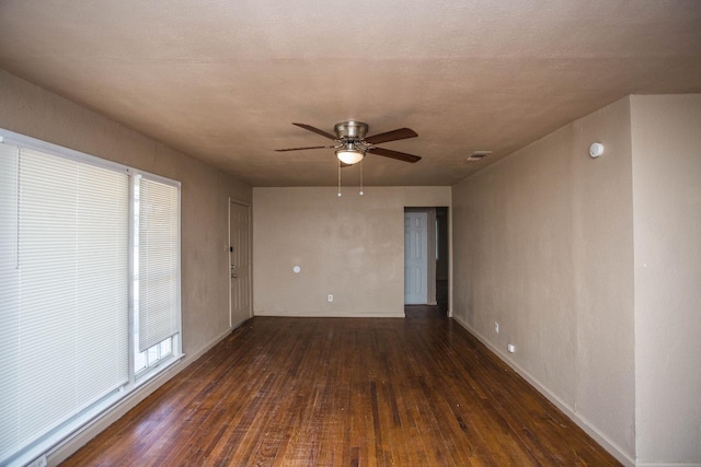 unfurnished room featuring ceiling fan and dark hardwood / wood-style floors