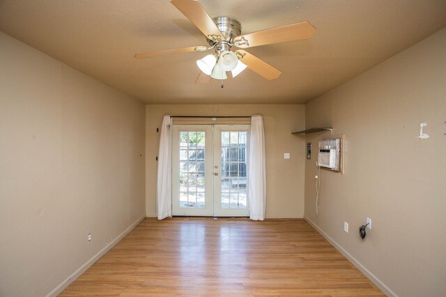 doorway featuring ceiling fan, light hardwood / wood-style floors, and french doors