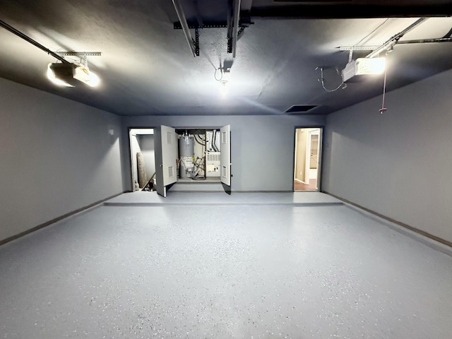 3506 97th St, Lubbock, TX 79423 - garage with gas water heater and a garage door opener