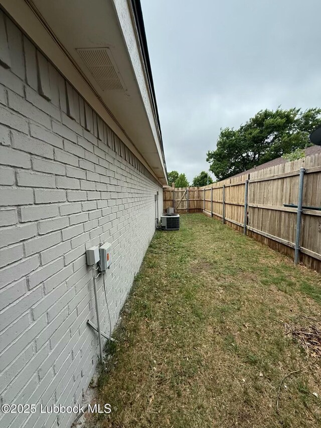 3506 97th St, Lubbock, TX 79423 - view of property exterior with brick siding and central air condition unit