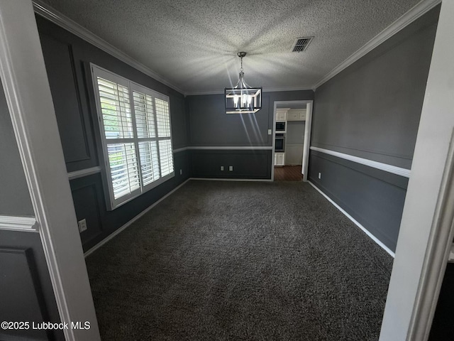 3506 97th St, Lubbock, TX 79423 - unfurnished dining area with a chandelier, dark colored carpet, crown molding, a textured ceiling, and baseboards