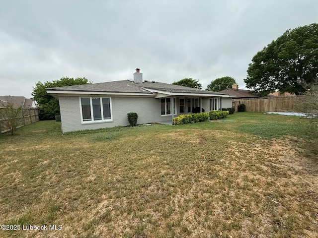 3506 97th St, Lubbock, TX 79423 - rear view of property with brick siding and a chimney