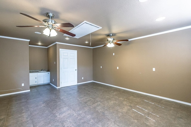 unfurnished bedroom featuring ceiling fan, crown molding, and a textured ceiling