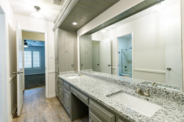 bathroom with hardwood / wood-style flooring, vanity, and toilet