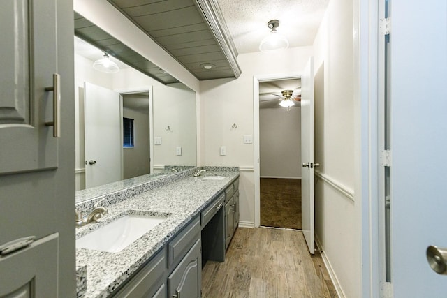 bathroom featuring vanity, wood-type flooring, and ceiling fan