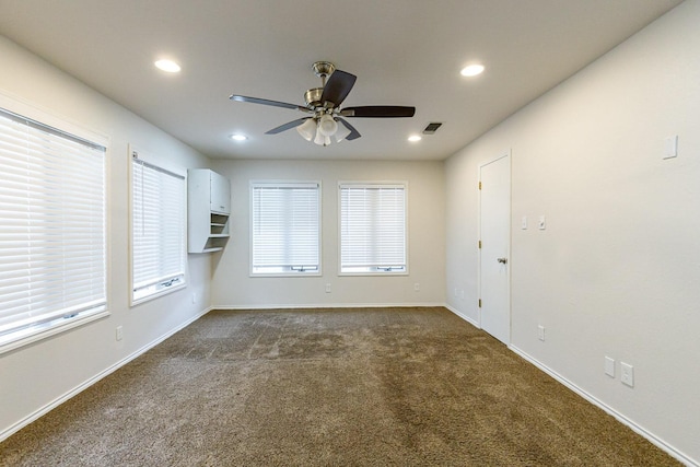 carpeted empty room with ceiling fan