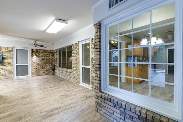 wooden deck with ceiling fan