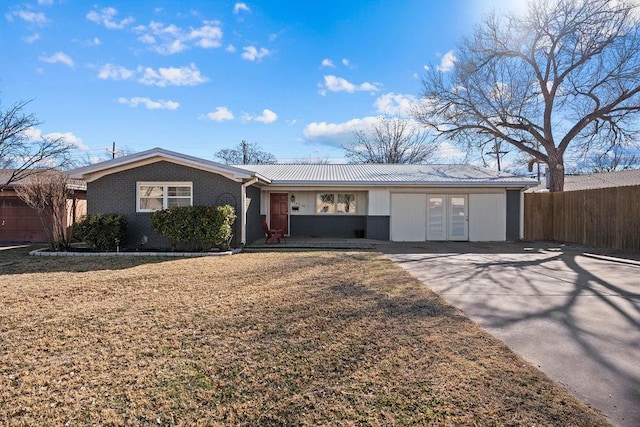 ranch-style house featuring a front lawn and french doors