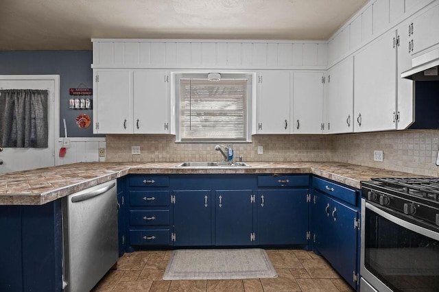 kitchen featuring blue cabinets, sink, white cabinets, and appliances with stainless steel finishes