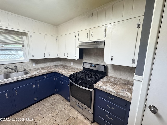 2721 52nd St, Lubbock, TX 79413 - kitchen featuring a sink, stainless steel gas range oven, under cabinet range hood, decorative backsplash, and blue cabinets