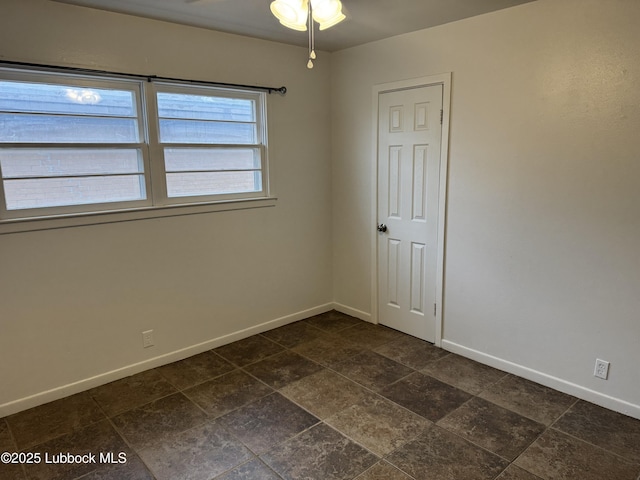2721 52nd St, Lubbock, TX 79413 - empty room featuring baseboards and a ceiling fan