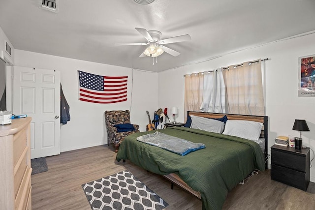 bedroom featuring hardwood / wood-style flooring and ceiling fan