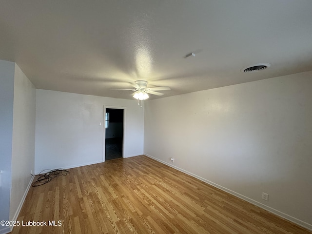 2721 52nd St, Lubbock, TX 79413 - empty room featuring baseboards, light wood finished floors, ceiling fan, and visible vents