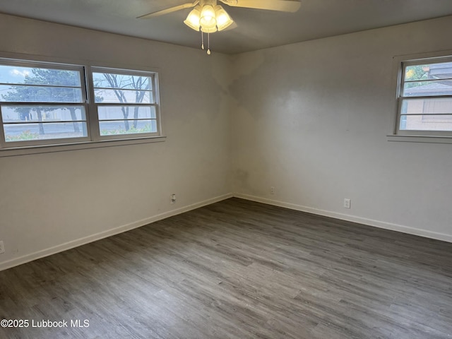 2721 52nd St, Lubbock, TX 79413 - spare room with baseboards, ceiling fan, plenty of natural light, and wood finished floors