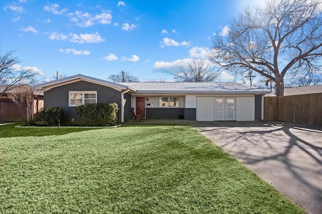 ranch-style house with french doors and a front lawn