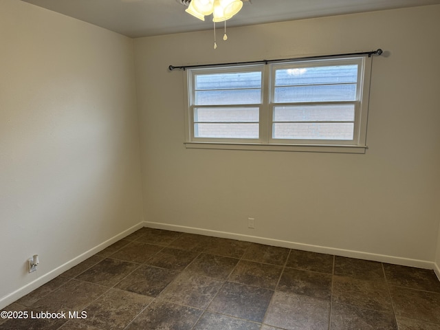 2721 52nd St, Lubbock, TX 79413 - spare room with baseboards and a ceiling fan