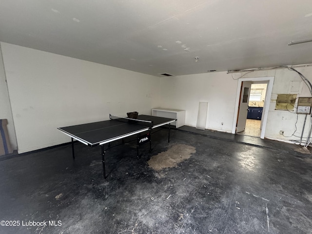 2721 52nd St, Lubbock, TX 79413 - playroom with unfinished concrete flooring
