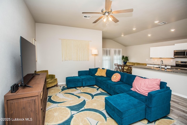 10422 Waverly Ave, Lubbock, TX 79424 - living room with light wood-type flooring, recessed lighting, ceiling fan, and lofted ceiling