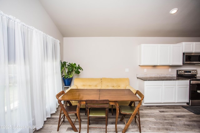 10422 Waverly Ave, Lubbock, TX 79424 - dining space featuring vaulted ceiling, light wood-type flooring, and recessed lighting