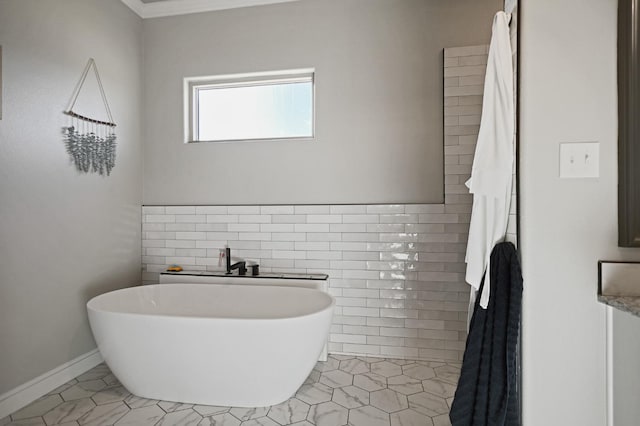 bathroom featuring tile patterned flooring, tile walls, and a bathtub