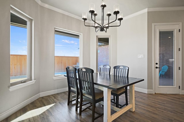 dining space featuring crown molding, dark hardwood / wood-style flooring, and an inviting chandelier