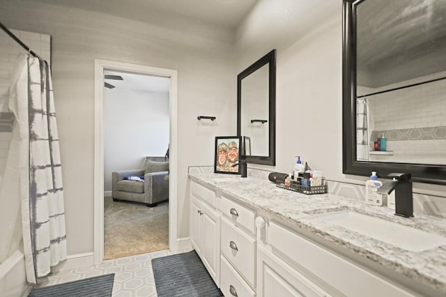 bathroom with vanity and shower / tub combo with curtain