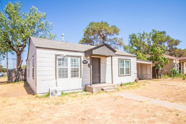 view of front of property featuring ac unit