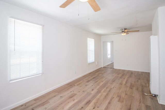 unfurnished room featuring light hardwood / wood-style flooring and ceiling fan