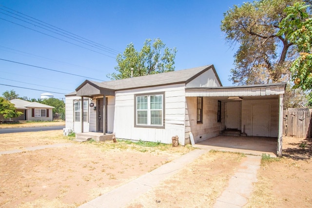 view of front of home with a carport