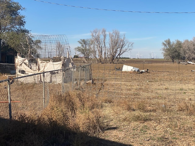view of yard with a rural view