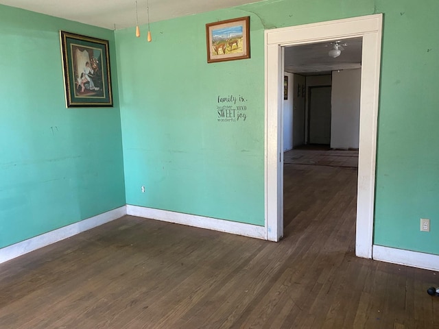 unfurnished room featuring dark hardwood / wood-style flooring