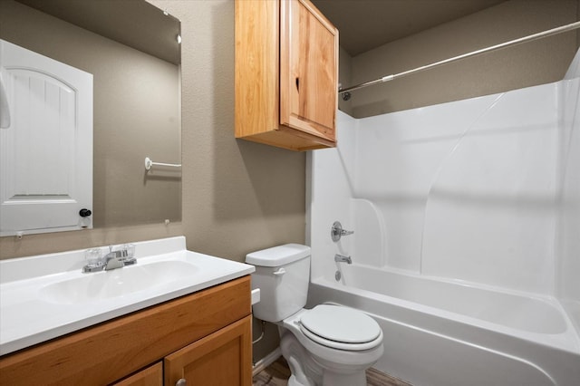 full bathroom featuring vanity, toilet, and  shower combination