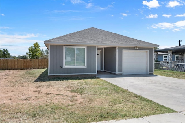 ranch-style house with a garage and a front lawn