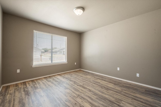 unfurnished room featuring wood-type flooring