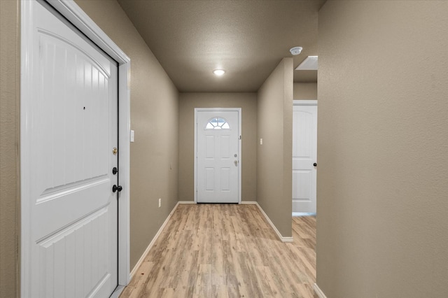 doorway with light hardwood / wood-style flooring