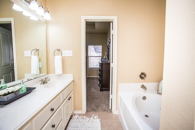 bathroom featuring vanity, tile patterned floors, and a bathtub