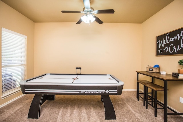 recreation room with carpet flooring and ceiling fan