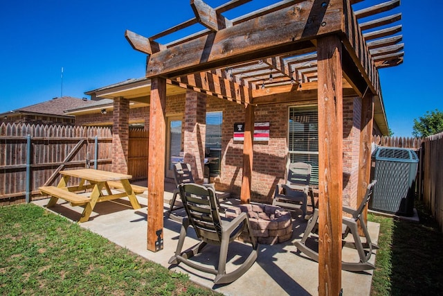 view of patio featuring a fire pit and a pergola