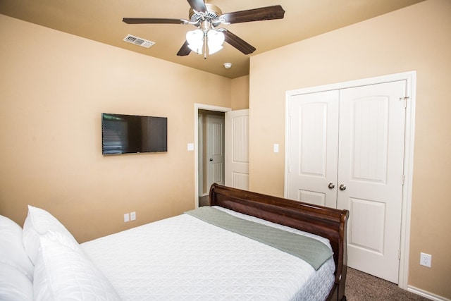 carpeted bedroom with a closet and ceiling fan